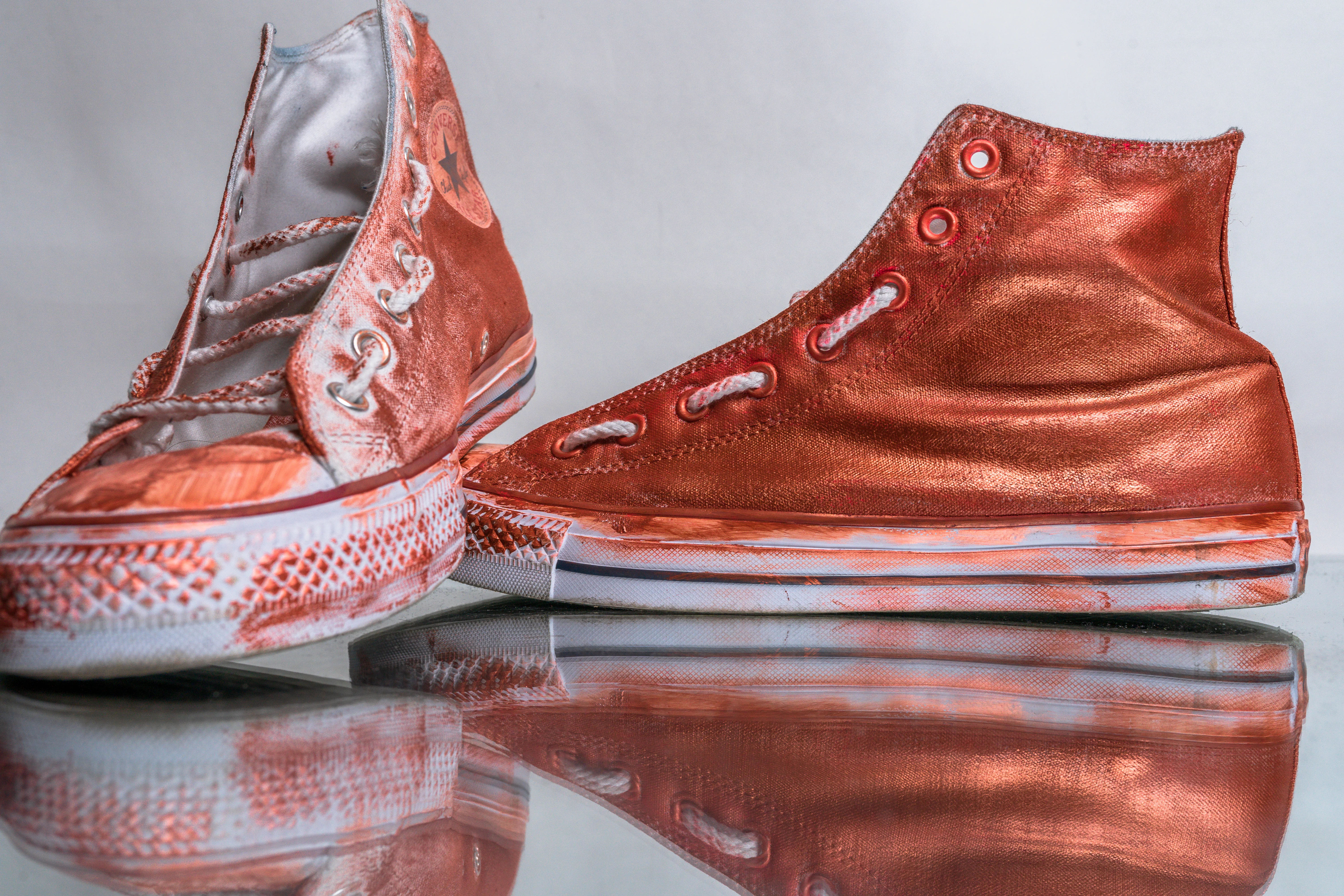 Custom Converse Chuck Taylor high-top sneakers with metallic copper and gold paint