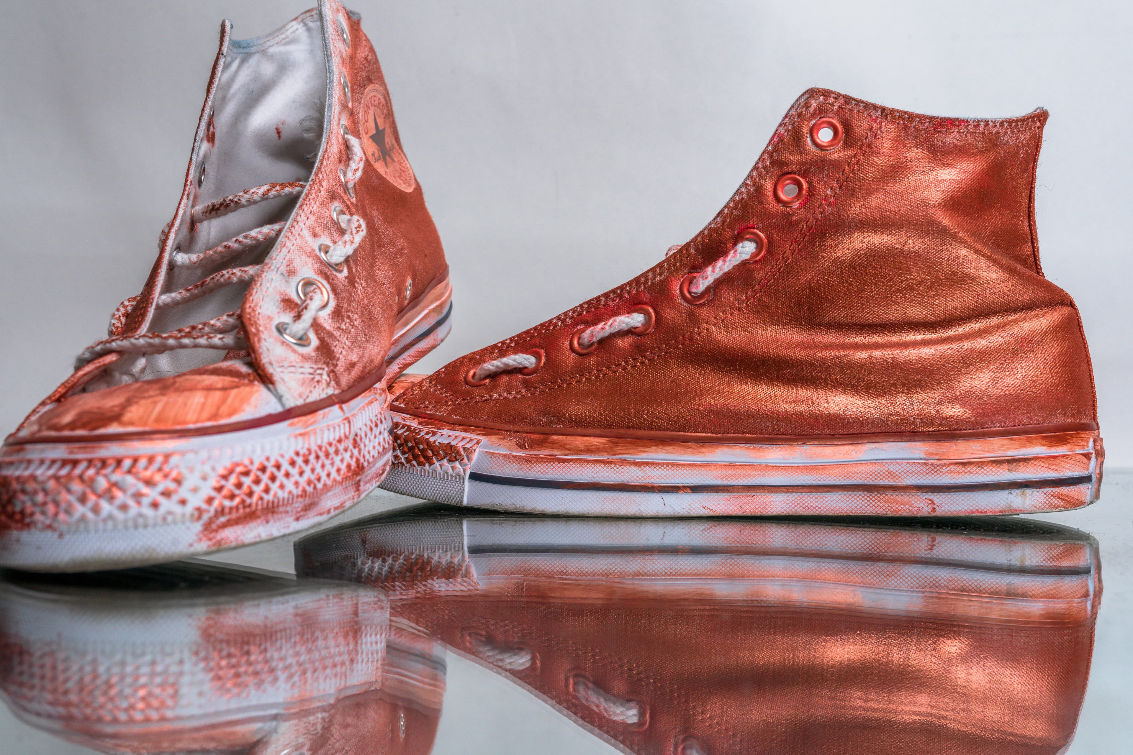 Custom Converse Chuck Taylor high-top sneakers with metallic copper and gold paint
