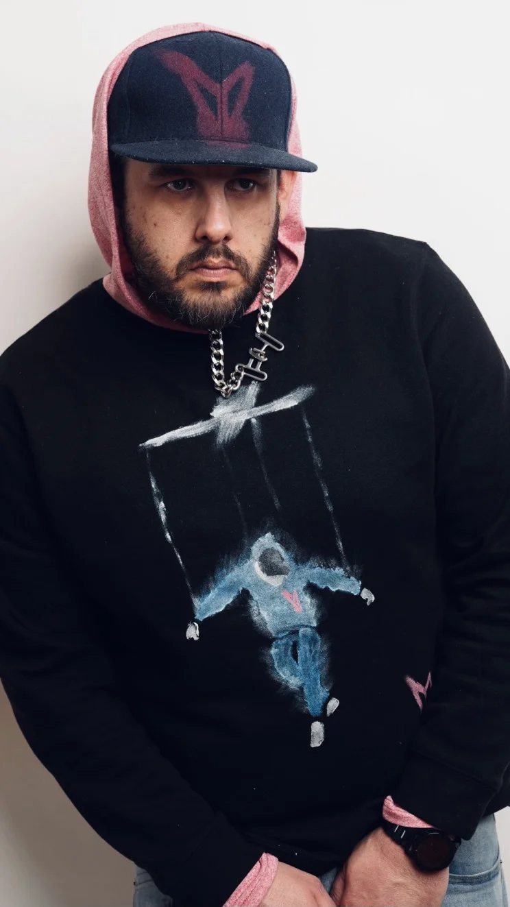 Model showcasing matching hand-painted coordinate bucket hat and shirt